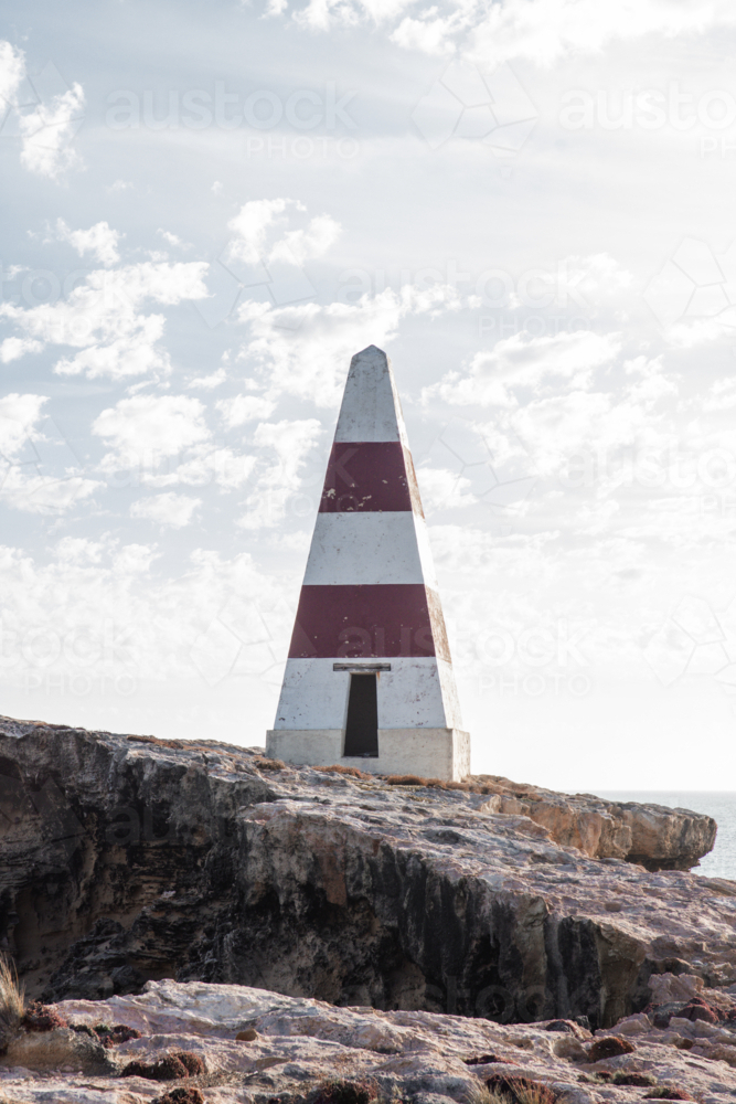 Old red and white striped obelisk (lighthouse) in Robe - Australian Stock Image