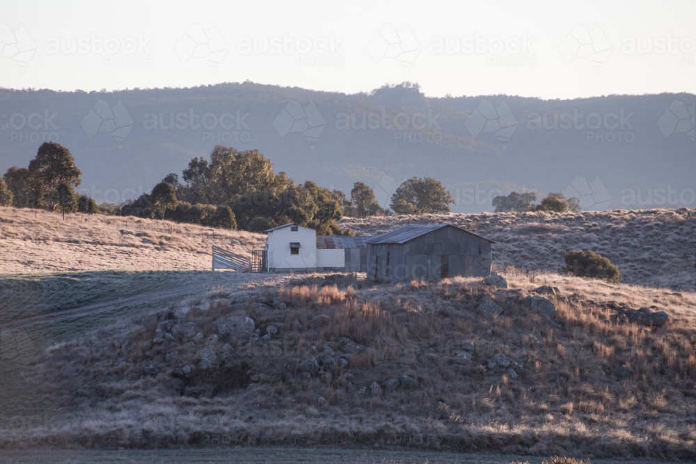 Old shed on a hill early one winter's morning - Australian Stock Image