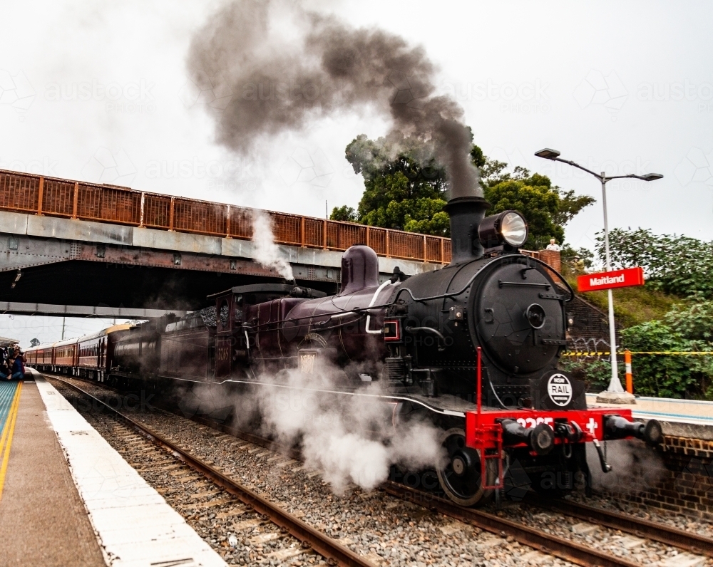 Old steam train engine at Steamfest pulling out of the train station in Maitland - Australian Stock Image