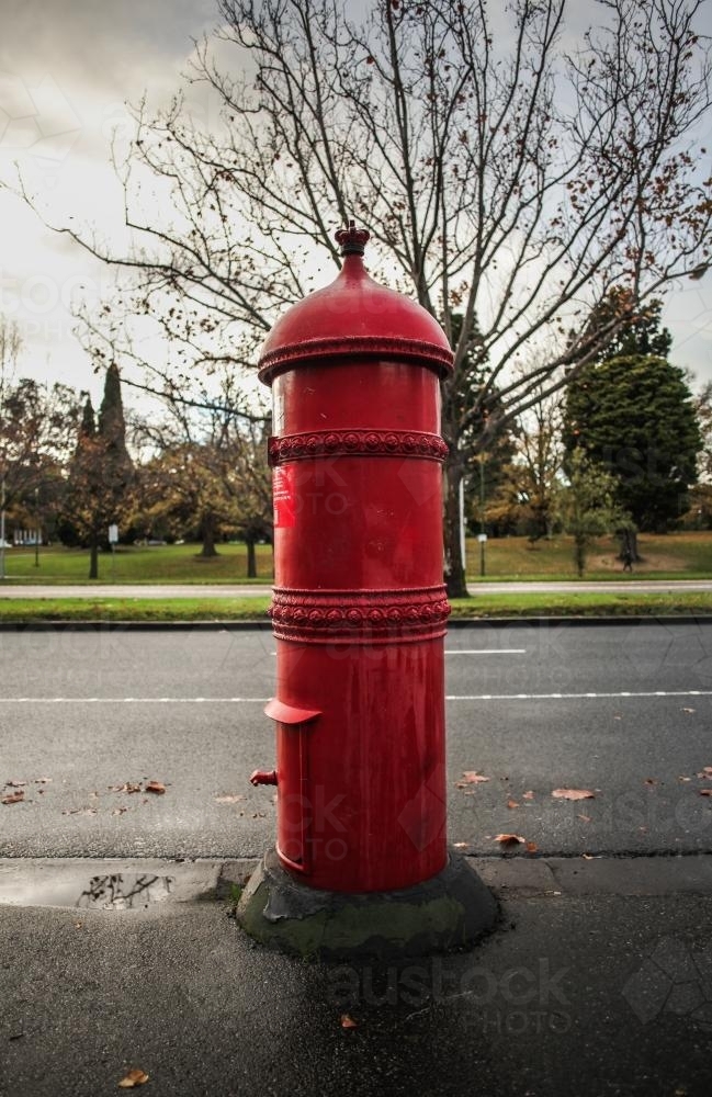Old style red post box on the street in Melbourne - Australian Stock Image