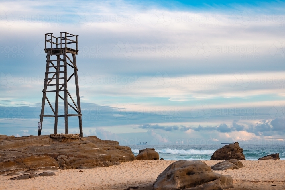 Old wooden lifeguard, shark lookout tower on Redhead Beach - Australian Stock Image