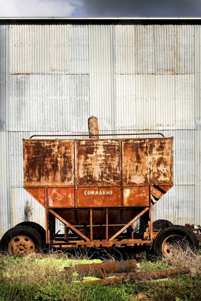 Olf farm machinery and corrugated iron shed - Australian Stock Image