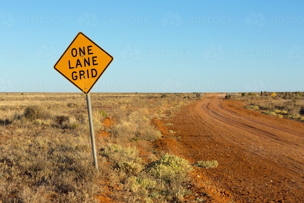 One Lane Grid sign on outback road - Australian Stock Image
