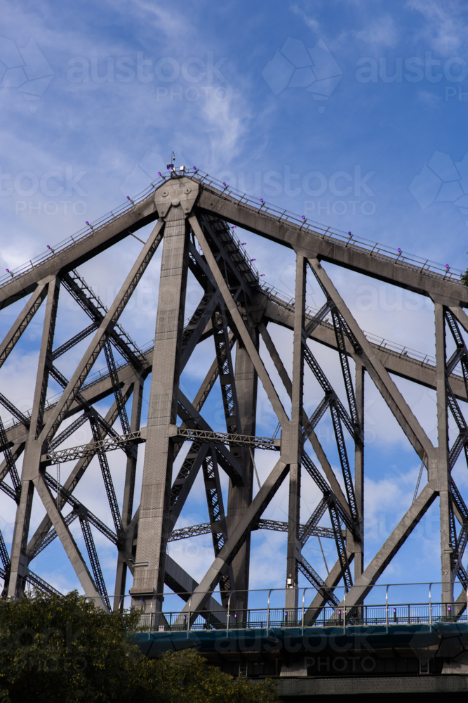 one of the highest points of the Story Bridge in Brisbane with blue sky behind - Australian Stock Image