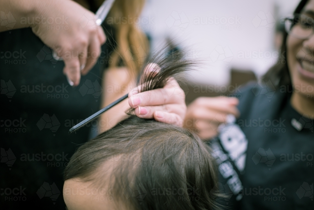 One year old mixed race baby boy has his first haircut - Australian Stock Image