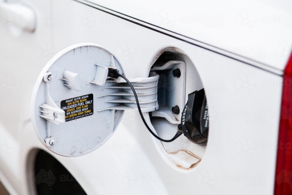 open cover on petrol cap on car - Australian Stock Image