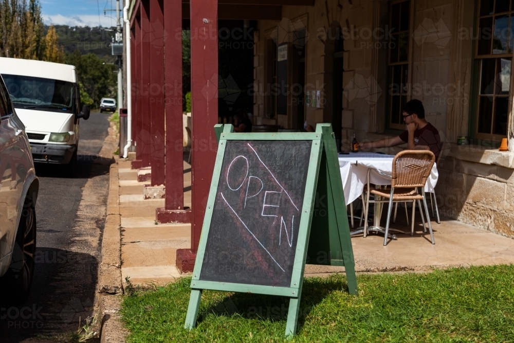 Image of Open sign for lunchtime at pub in small rural aussie town ...