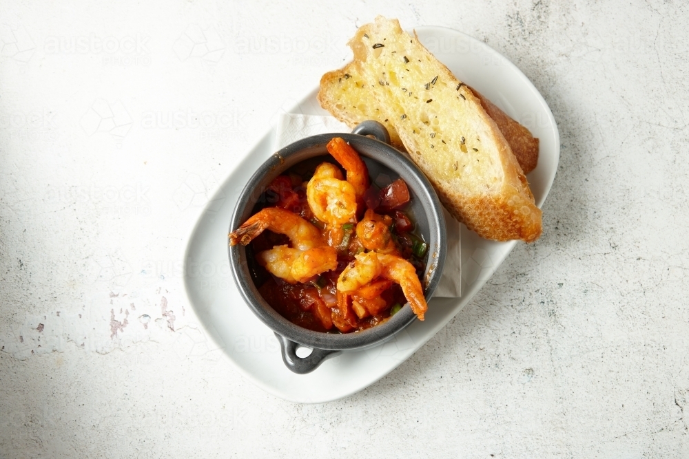 Orange buttered shrimp in a pot : Austockphoto Orange buttered shrimp in a pot - Australian Stock Image