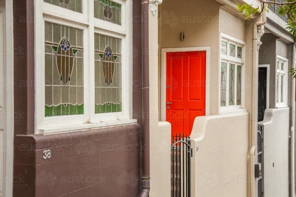 Orange door and windows of houses on a Newcastle street - Australian Stock Image