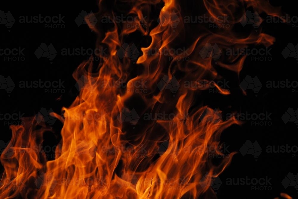 Orange fire flames in the night - Australian Stock Image