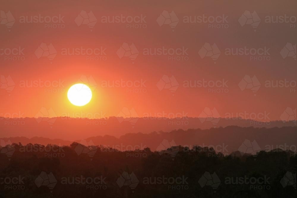 Orange sunset over hills - Australian Stock Image
