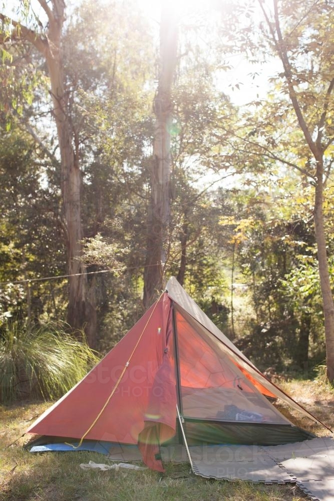 Orange tent at a campsite - Australian Stock Image