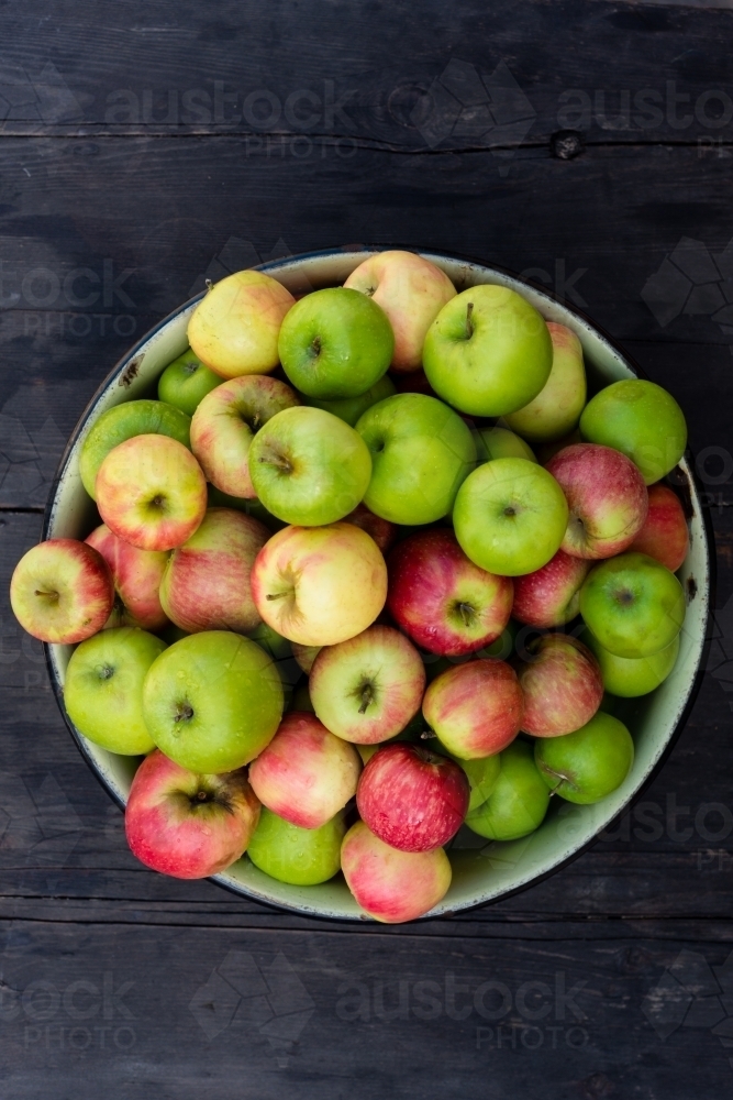 organic apples in a bowl - Australian Stock Image