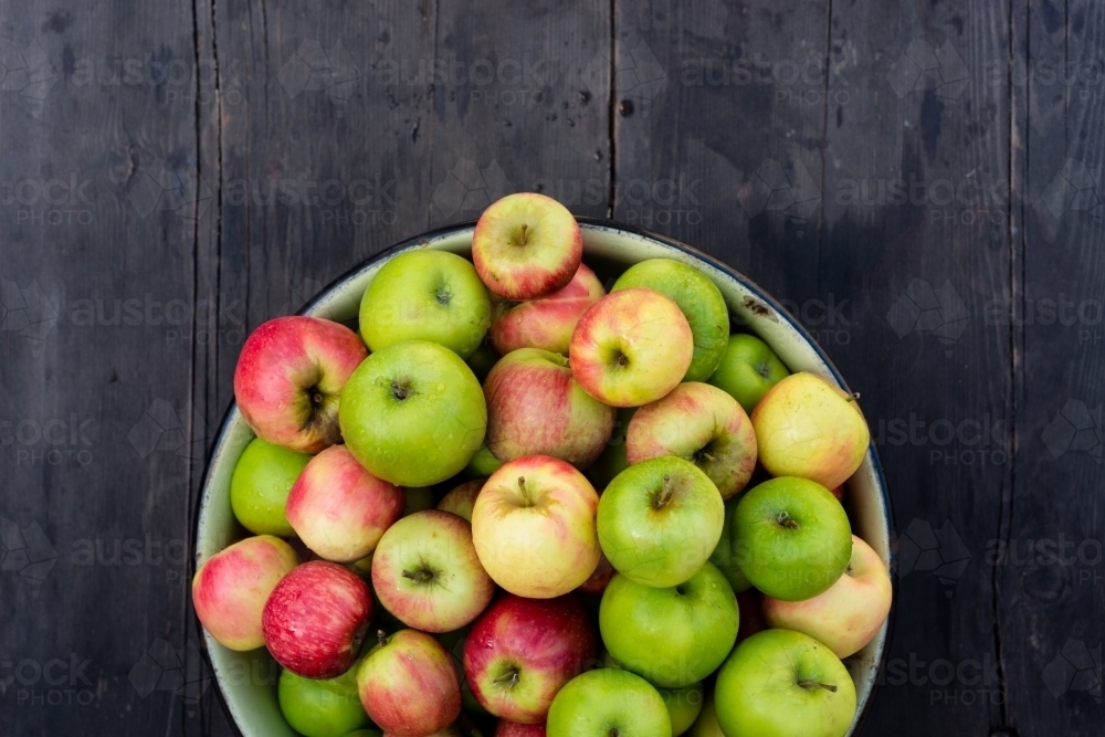 organic apples in a bowl - Australian Stock Image