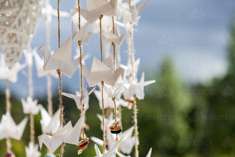 Image of Origami cranes on string decoration Austockphoto