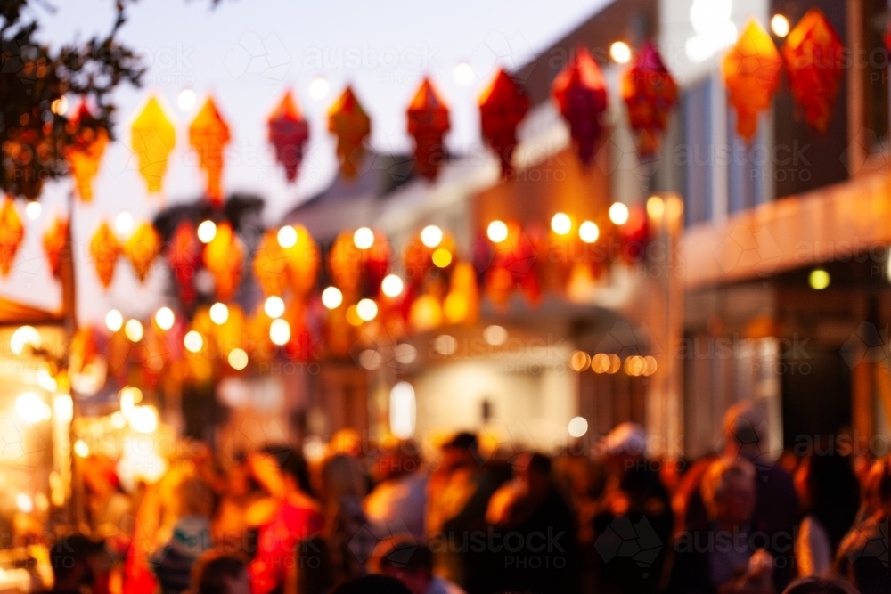 Out of focus background of bokeh lantern lights at multicultural celebration event - Australian Stock Image