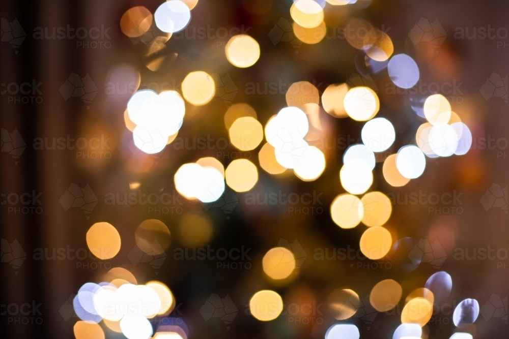 out of focus Christmas tree lights at night time - Australian Stock Image