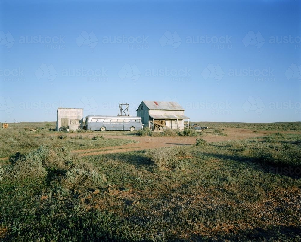 Outback cabin and bus with blue sky - Australian Stock Image