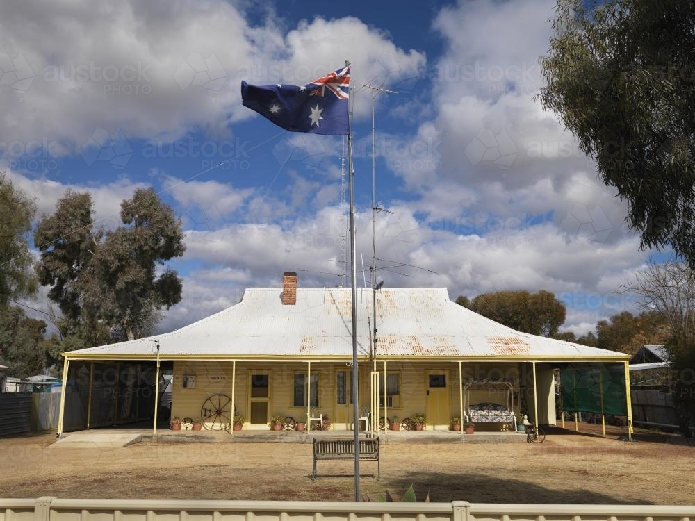 Outback homestead with Australian flag - Australian Stock Image