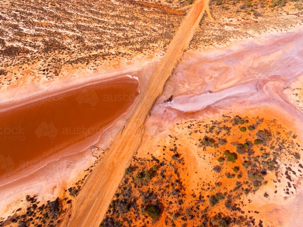 Outback road crossing salt lake - Australian Stock Image