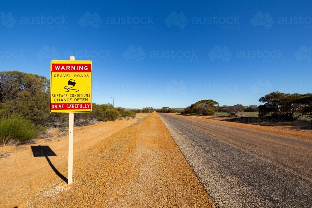 outback road sign warning of changing road conditions - Australian Stock Image
