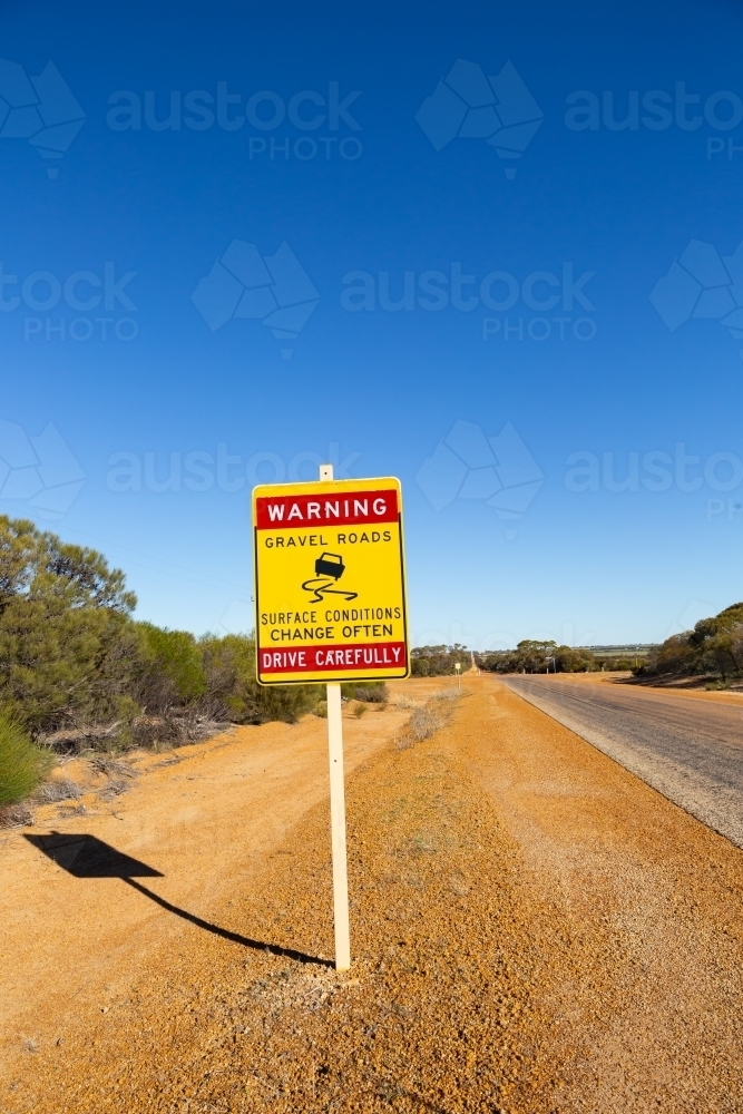 outback road sign warning of changing road conditions - Australian Stock Image