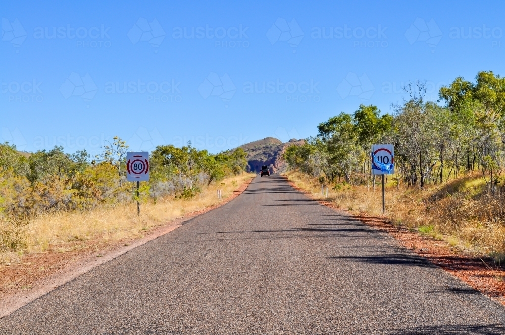outback road with speed signs - Australian Stock Image