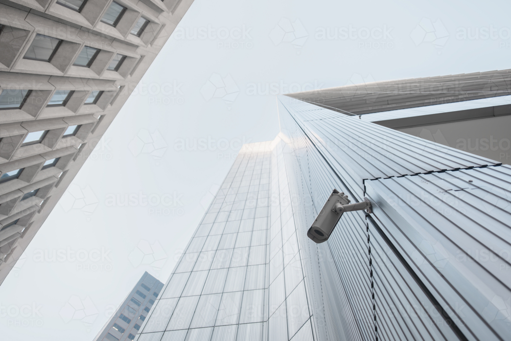 Outdoor CCTV video surveillance security camera installed on the building in the city - Australian Stock Image