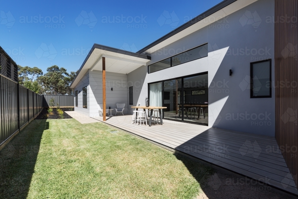 Outdoor entertaining deck and lawn of a new home - Australian Stock Image