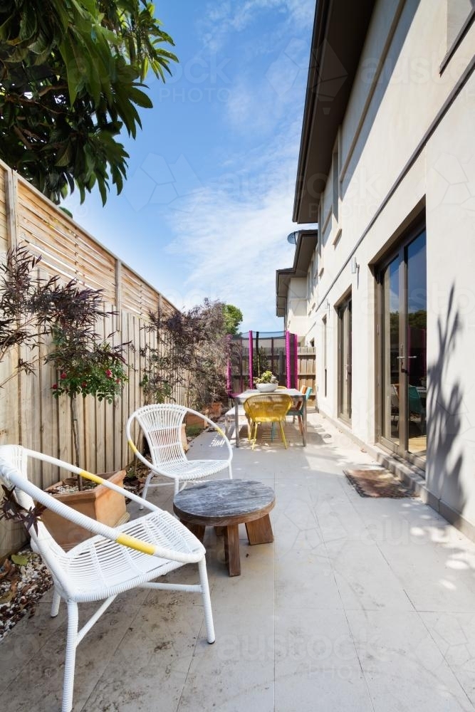 Outdoor paved courtyard in contemporary Australian townhouse home - Australian Stock Image