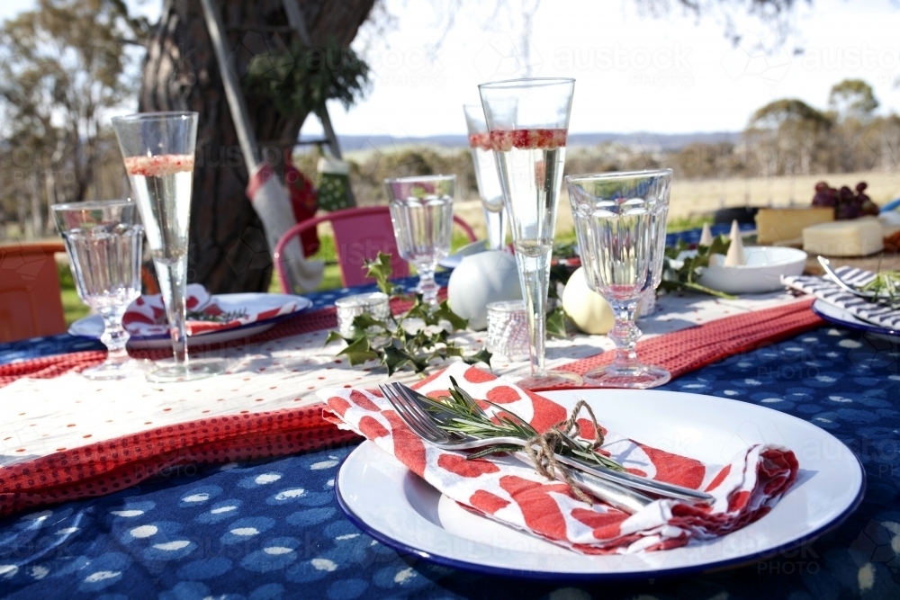 Outdoor table setting ready for Christmas celebration - Australian Stock Image