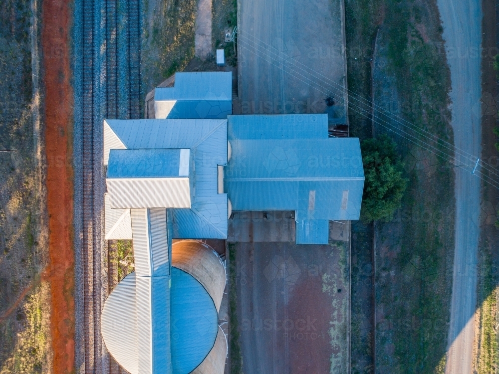 Overhead aerial photo of grain silos next to train line - Australian Stock Image