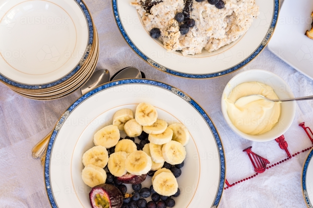 overhead of breakfast food, bircher and banana - Australian Stock Image