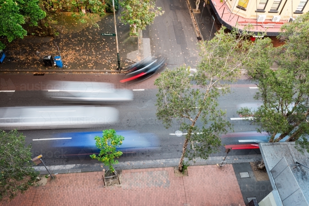overhead of moving traffic on city street - Australian Stock Image