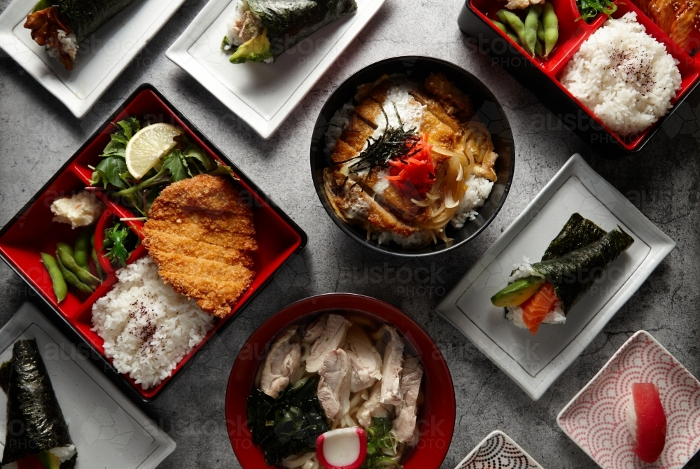 Overhead shot of different food dishes on a flat surface. - Australian Stock Image