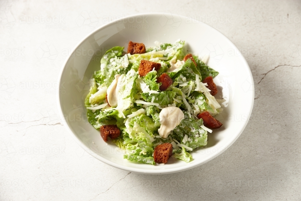 Overhead shot of gourmet chicken caesar salad - Australian Stock Image