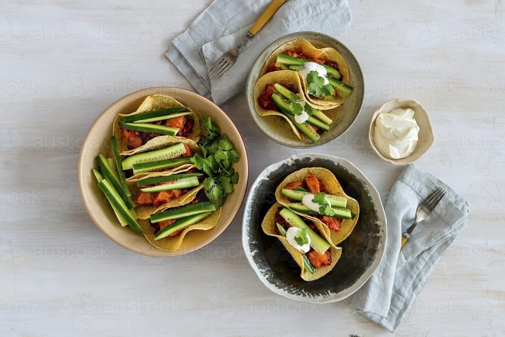 Overhead shot of healthy vegetarian tortillas on bench - Australian Stock Image