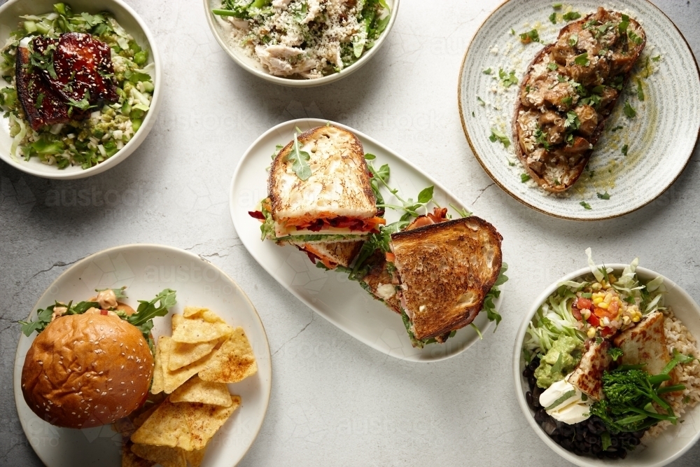 Overhead shot of various lunch dishes - Australian Stock Image