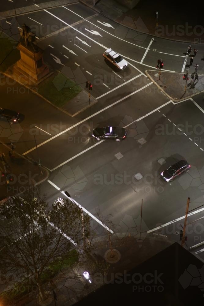 Overhead view of cars driving through an intersection in the city - Australian Stock Image