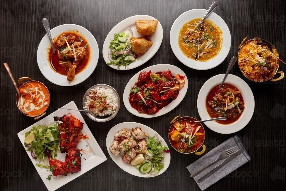Overhead view of Indian dishes on table - Australian Stock Image