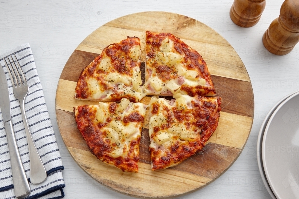 Overhead view of pizza on table - Australian Stock Image