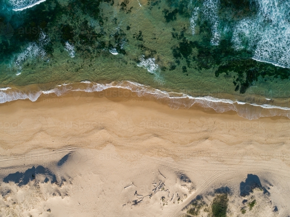 Overhead view of sand dunes to beach and ocean water - Australian Stock Image