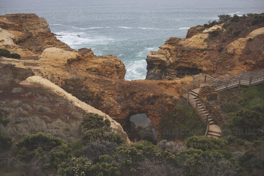 Overlooking cliffs and stairs of the Great Ocean Road landscape - Australian Stock Image
