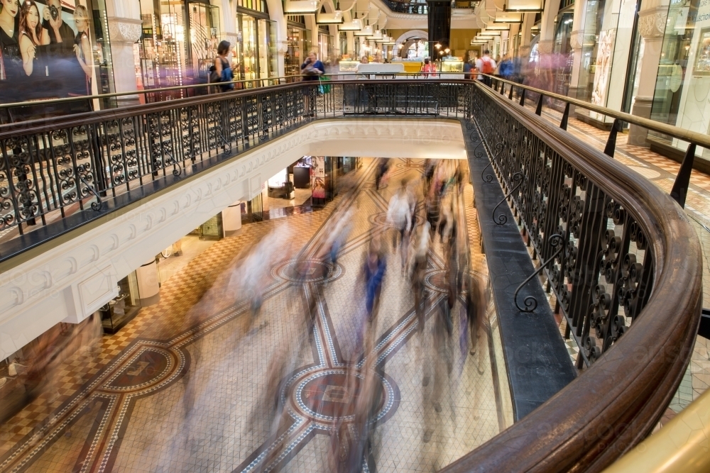 Overlooking commuters and shoppers blurred in motion at the Queen Victoria Building - Australian Stock Image