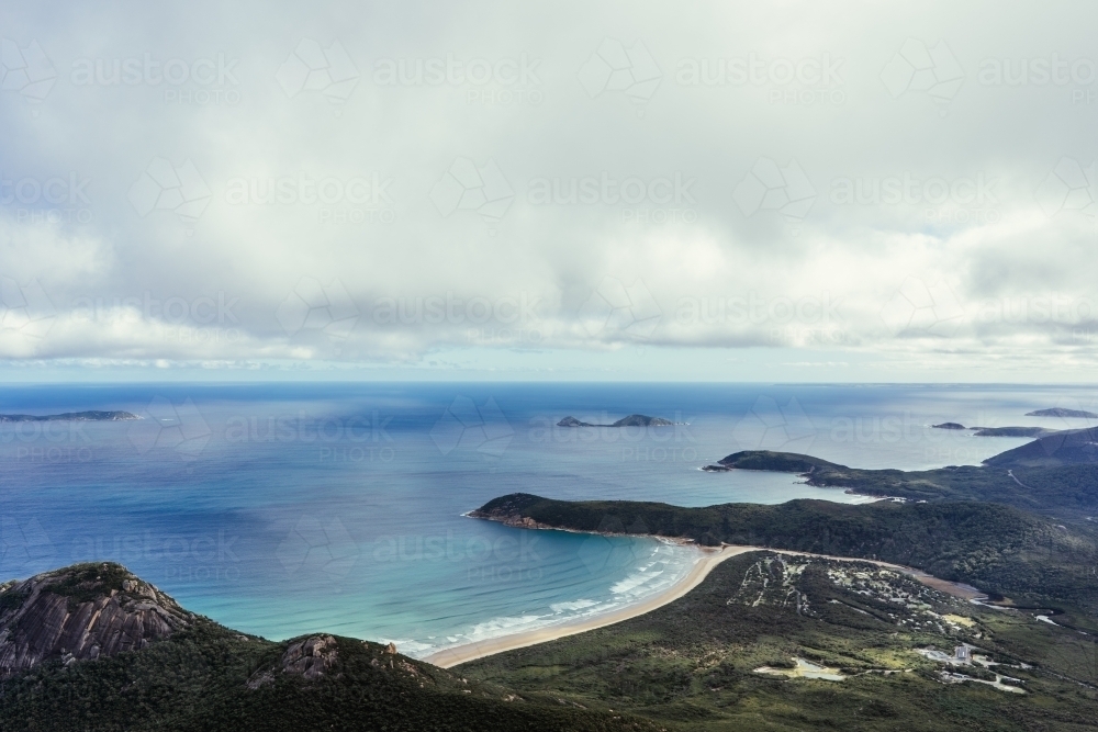 Overlooking rock formations and open sea in Victoria shrouded with clouds - Australian Stock Image