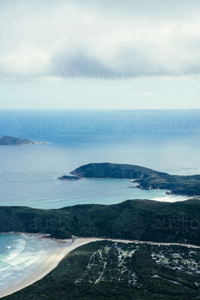 Overlooking rock formations and open sea in Victoria shrouded with clouds - Australian Stock Image
