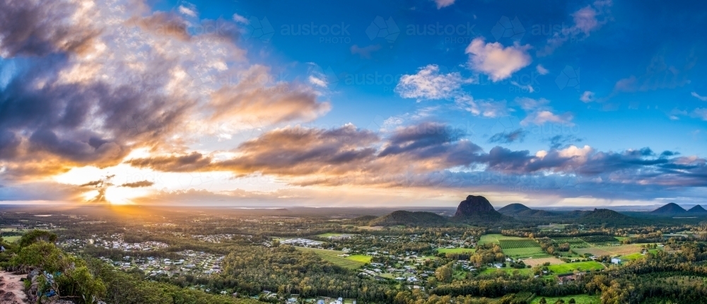 Overlooking valley and mountains with sunrise behind - Australian Stock Image