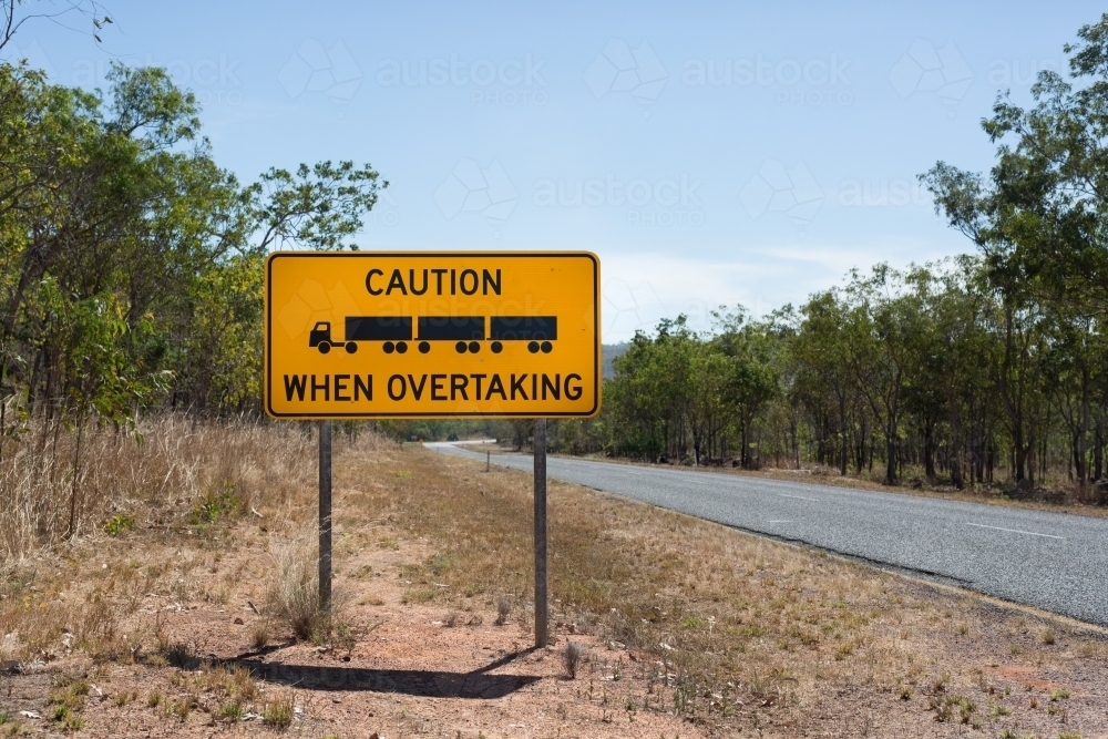 Overtaking signage on an empty road - Australian Stock Image