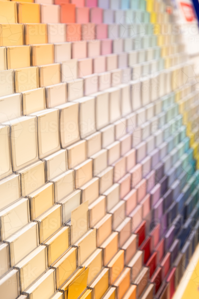 Image of paint sample colours in racks at a hardware store - Austockphoto