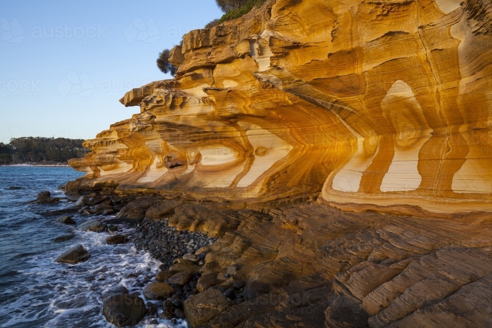 Painted Cliffs at sunset - Maria Island National Park - Tasmania - Australia - Australian Stock Image